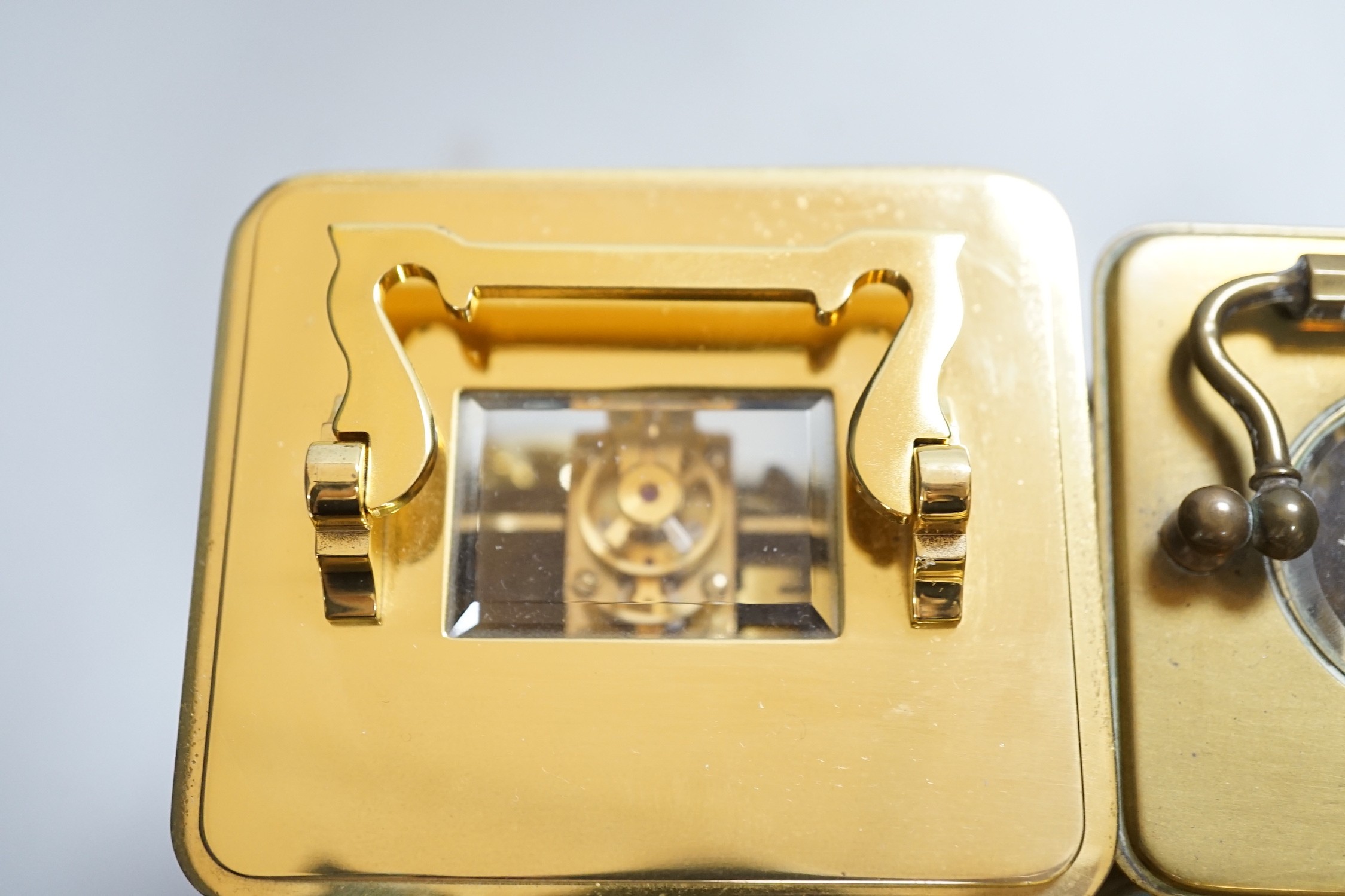 Two brass cased carriage timepieces and a brass cased carriage clock, tallest 11.5cms high